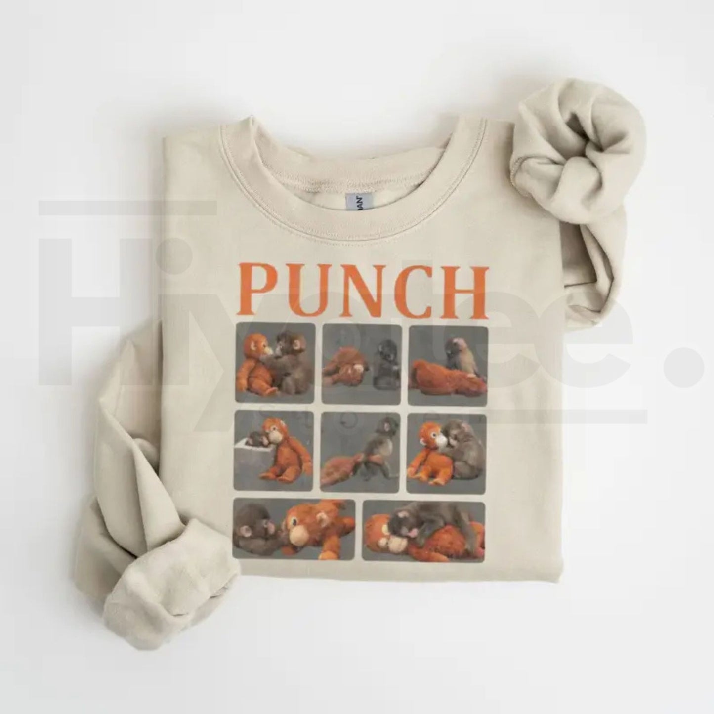 Monkey Punch Graphic Sweatshirt: Cute Baby Monkey Holding Plush Toy Crewneck