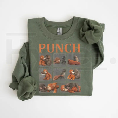 Monkey Punch Graphic Sweatshirt: Cute Baby Monkey Holding Plush Toy Crewneck