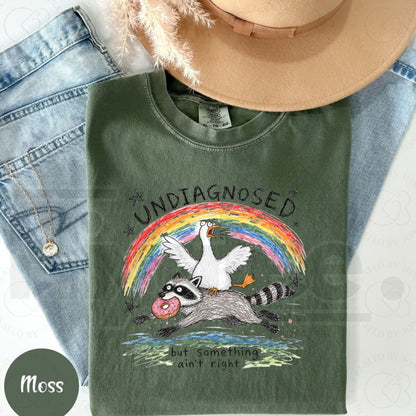 Comfort Colors Undiagnosed But Something Ain't Right T-Shirt – Funny Goose Riding Raccoon Tee