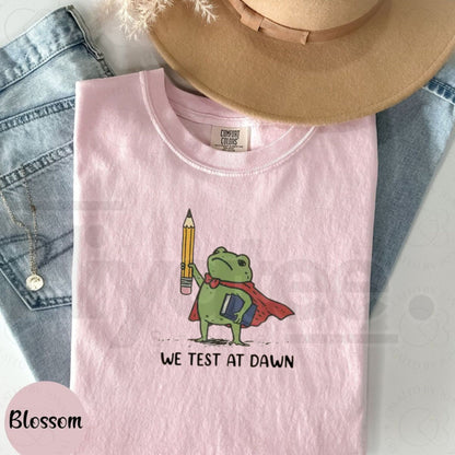 Comfort Colors® We Test At Dawn Funny Teacher Frog Shirt – Exam Day Humor Tee
