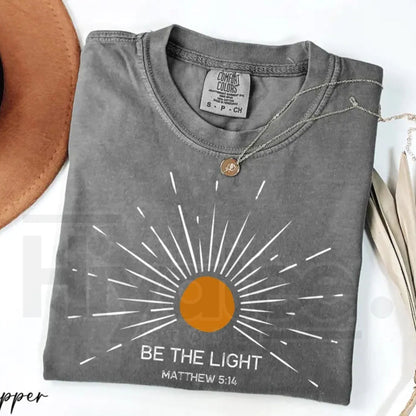 Comfort Colors® Be The Light Shirt – Trendy Bible Verse & Religious Faith Graphic Tee