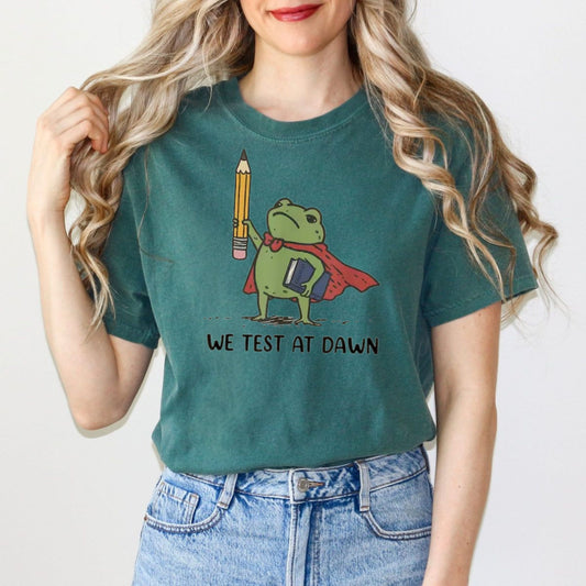 Comfort Colors® We Test At Dawn Funny Teacher Frog Shirt – Exam Day Humor Tee - Hiyatee
