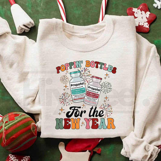 ICU Nurse New Year 2026 Sweatshirt: Poppin Bottles Propofol Funny Nursing Shirt  - Hiyatee