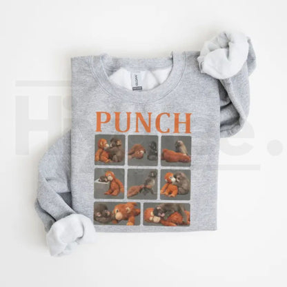 Monkey Punch Graphic Sweatshirt: Cute Baby Monkey Holding Plush Toy Crewneck - Hiyatee